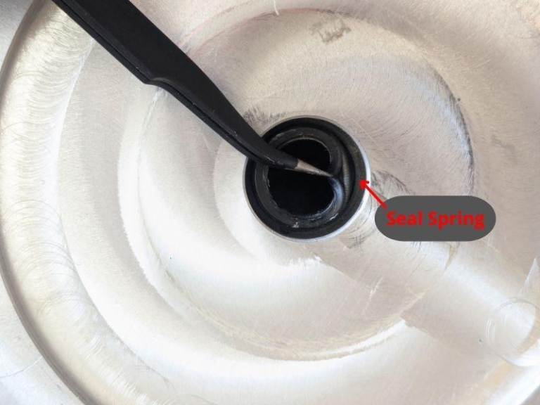 Close-up of motor shaft seal with seal spring highlighted