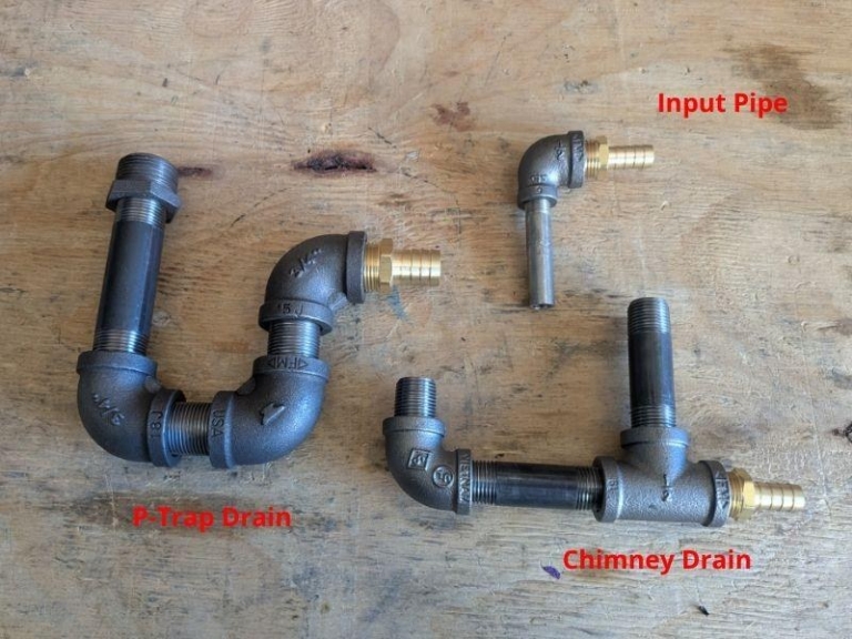Three plumbing fitting assemblies: input pipe, P-trap drain, and chimney drain