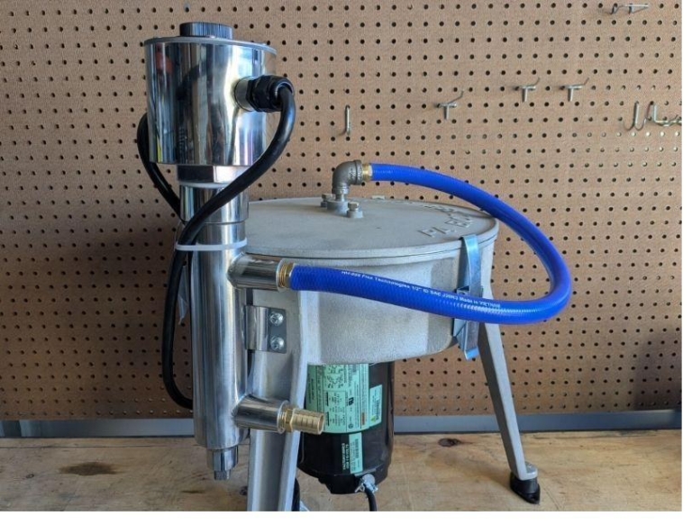 Assembled drain fittings with hose barbs mounted on centrifuge